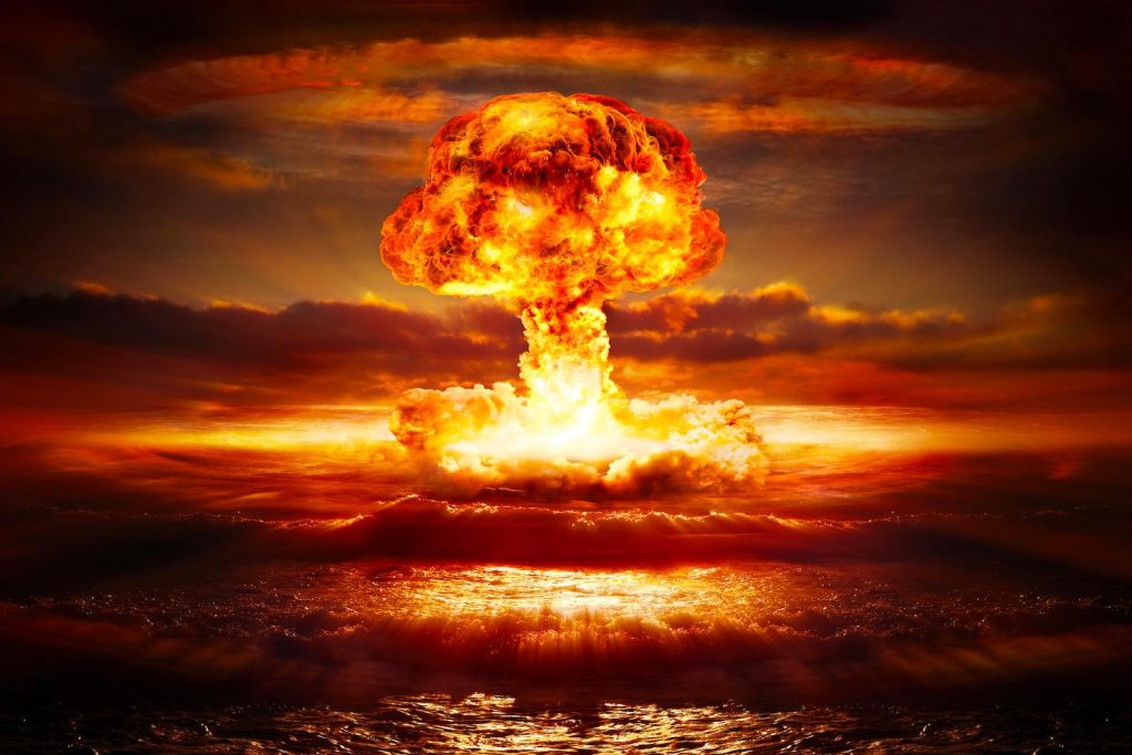 Nuclear explosion going off in the ocean creating a mushroom cloud