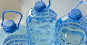 blue plastic bottles of clean drinking water