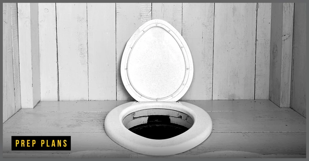 white composting toilet with the lid open