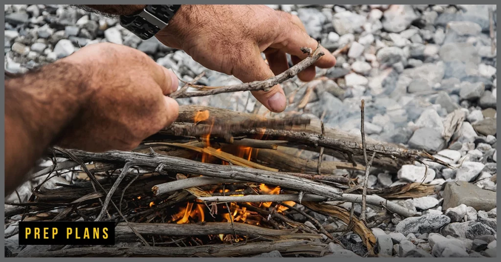 building a fire with kindling in the woods 
