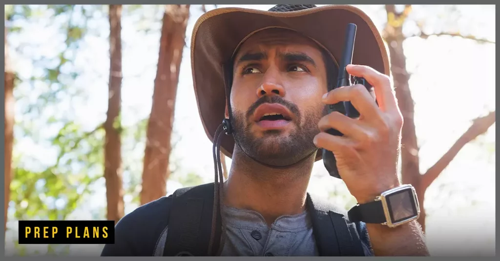 man using a walk talkie to communicate off grid