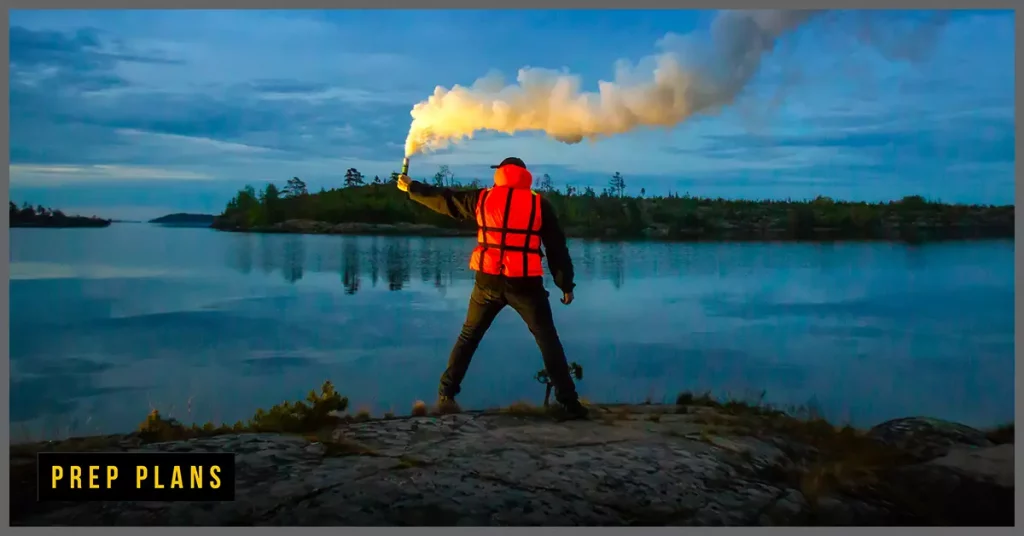 man using a flare to capture attention of other people for help